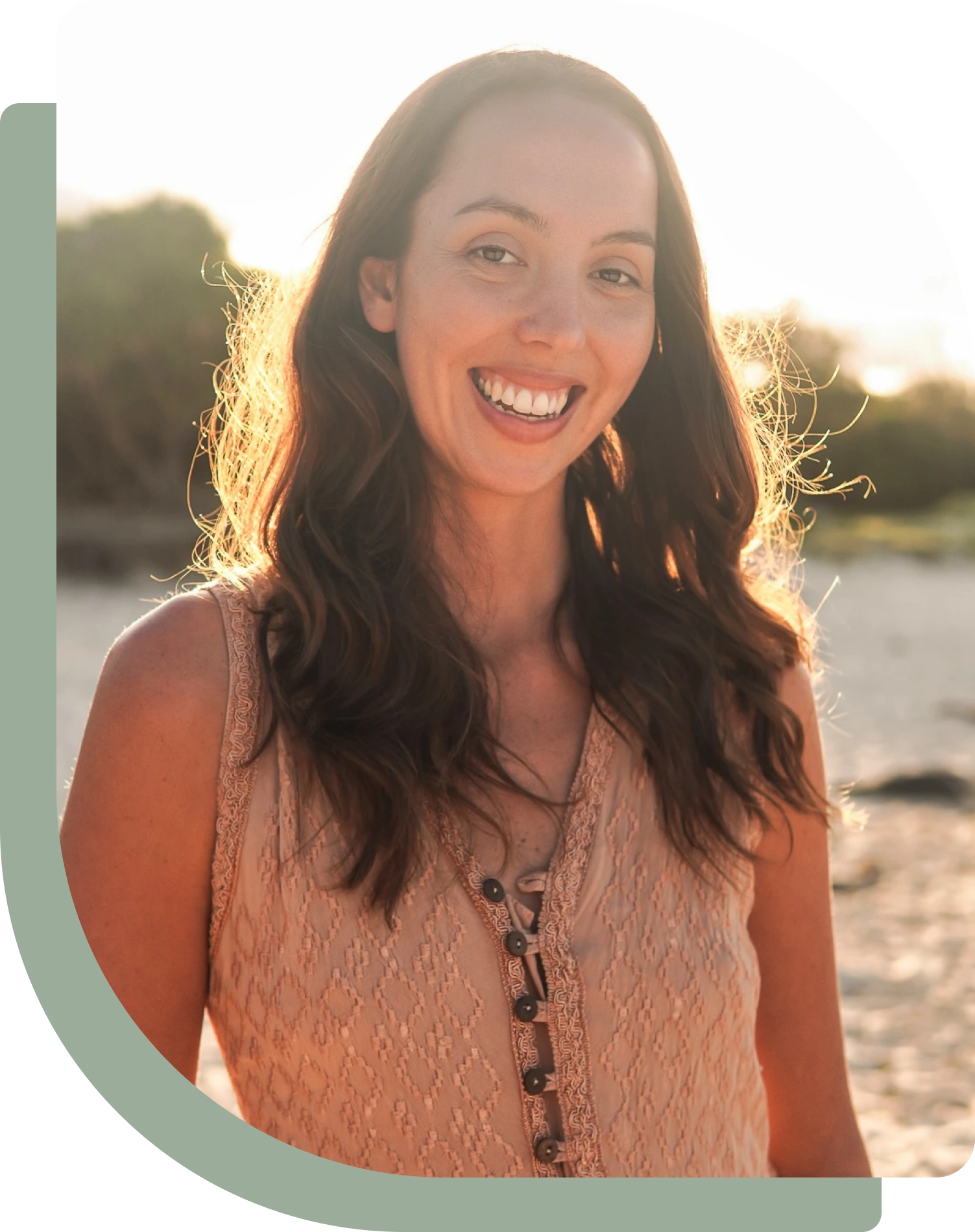 Tori Reid, Hakomi informed somatic psychotherapist and founder of InnerBloom, smiling in warm afternoon light
